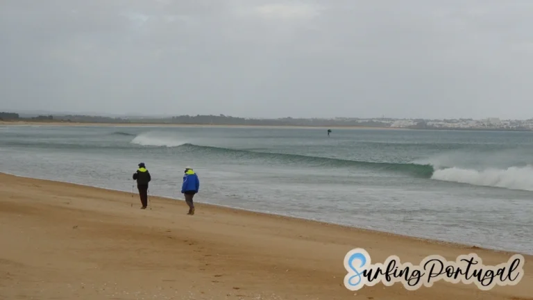 People strolling on Lagos Beach (Meia Praia)