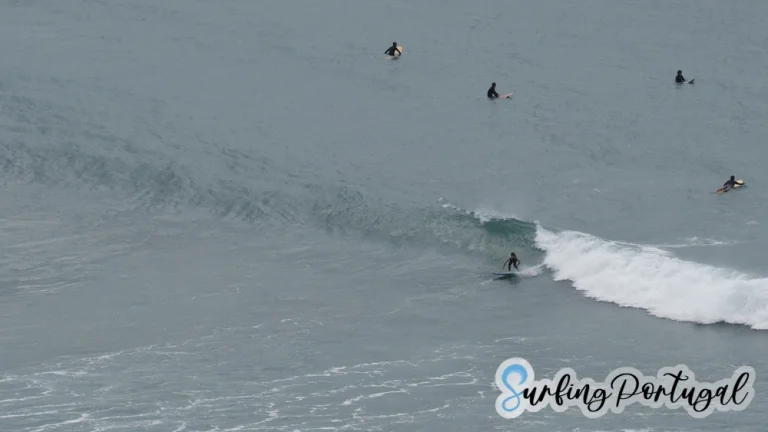 Surfer taking a +/- 1 meter high right wave in Arrifana