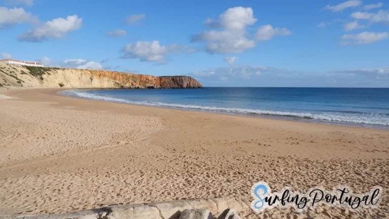 View of Praia da Mareta from the sand. The sky is blue and is a nice day