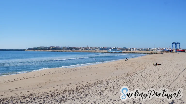Panoramic view of Molhe leste surf spot with people sitting on the beach