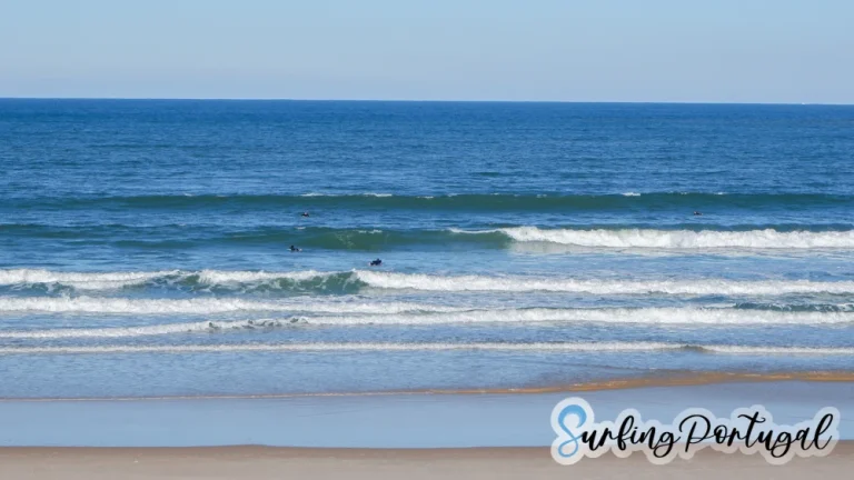 Surfers in the water at Peniche Cerro