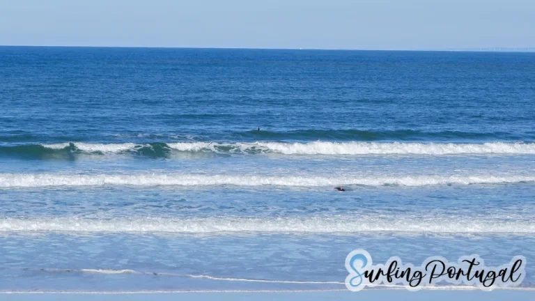 Surfers in the water at Peniche Cerro