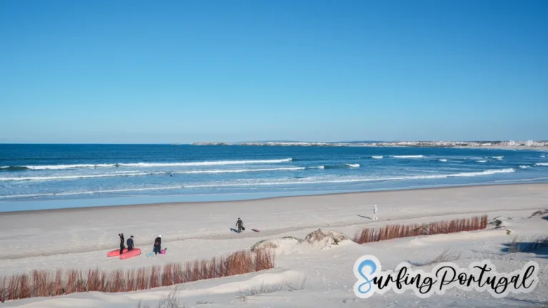 Surfers in the water at Peniche Cerro