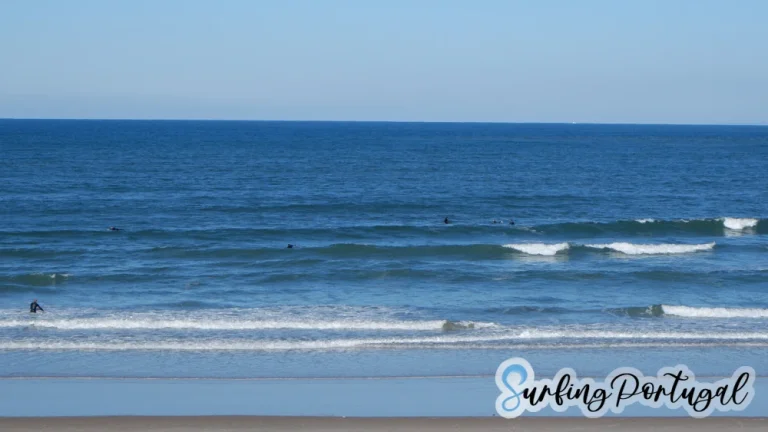 Surfers in the water at Peniche Cerro