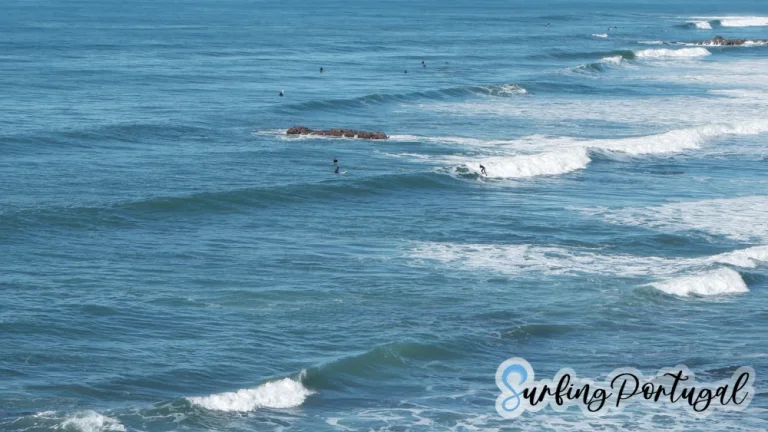 Surfer on a wave at Praia de São Sebastião, Ericeira