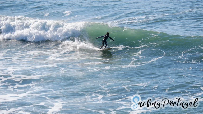 Surfer on a wave at Praia de São Sebastião, Ericeira