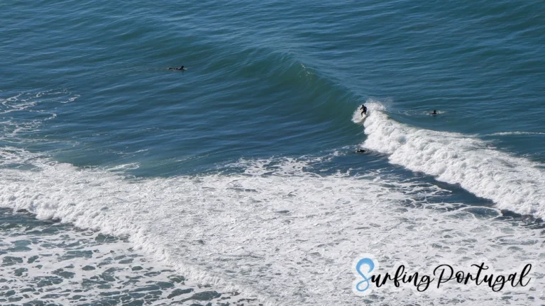 Surfer catching a right wave on Foz de Lizandro