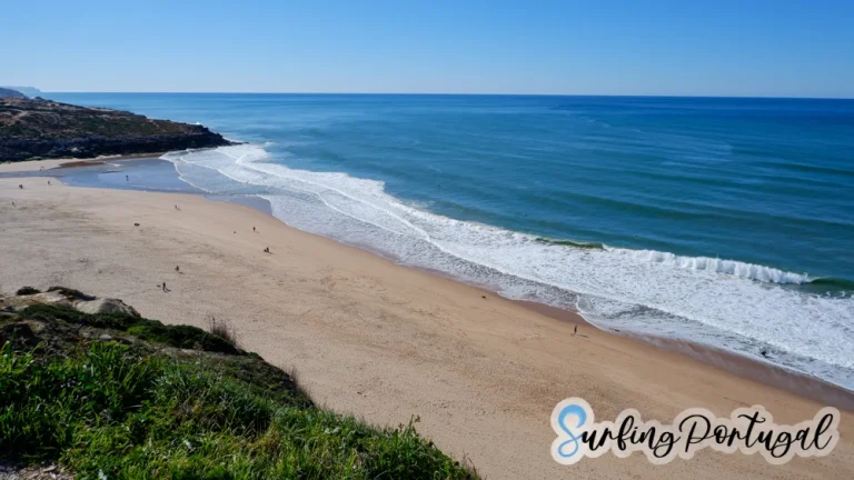 View of the whole bay of Foz de Lizandro on a sunny day and with some small waves breaking