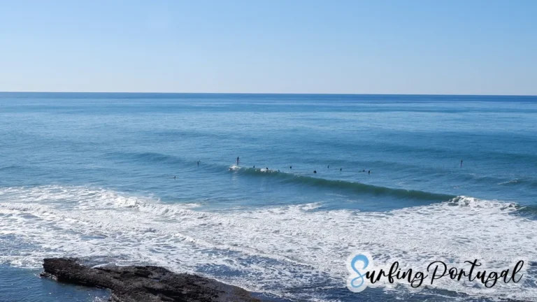 Surfers at Paparucos peak, in Matadouro