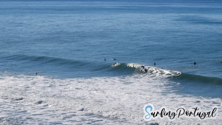 Surfers at Paparucos peak, in Matadouro