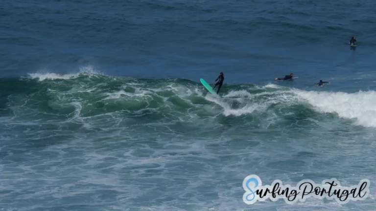 Surfer finishing a wave at Praia do Sul, Ericeira
