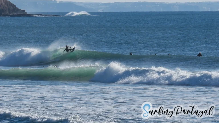 Surfer making a cut back on a wave at Supertubos, Peniche