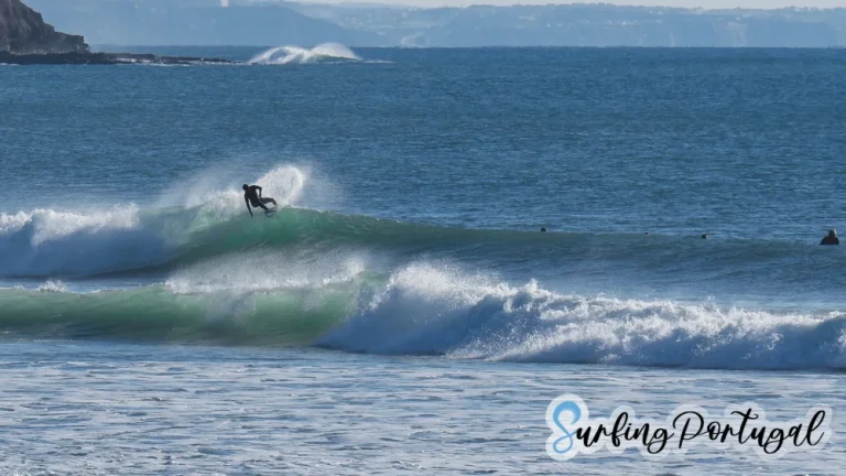 Surfer making a cut back on a wave at Supertubos, Peniche