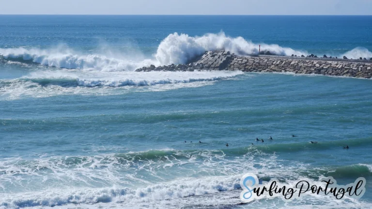 Wave crashing over the break water at praia dos Pescadores, Ericeira